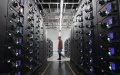 A worker maintains equipment at China Mobile's data center in a cloud computing base in Zhongwei City, northwest China's Ningxia Hui Autonomous Region. Photo by Xinhua/Wang Peng.