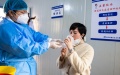 A resident receives a dose of inhalable COVID-19 vaccine at a community health service center in Tianxin District of Changsha, central China's Hunan Province. Photo by Xinhua/Chen Sihan.