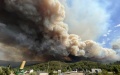 Smoke caused by a wildfire rising in El Barco de Valdeorras, Galicia, Spain. Photo by Xinhua.