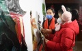 A girl experiences shadow puppetry inside the north division of Haidian culture center in Haidian District of Beijing, capital of China. Photo by Xinhua/Ren Chao.