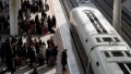 Passengers prepare to board a train at Fuyang West Railway Station in Fuyang City, east China's Anhui Province. Photo by Xinhua/Guo Chen.