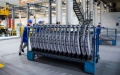 Staff members carry auto parts at a factory of Chinese automaker Chery Holding Group Co., Ltd. in Erdos, north China's Inner Mongolia Autonomous Region. Photo by Xinhua/Li Zhipeng.