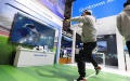 A visitor plays a sports game at the Intelligent Industry & Information Technology exhibition area of the fifth China International Import Expo (CIIE). Photo by Xinhua/Fang Zhe.