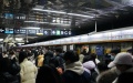 Passengers are seen at Hujialou Subway Station during morning peak hours in Beijing, capital of China.  Photo by Xinhua/Ju Huanzong.
