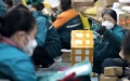 Staff members distribute parcels at a distribution center of China Post Group Co., Ltd. in Shijiazhuang, north China's Hebei Province. Photo by Liang Zidong/Xinhua.