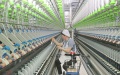 A woman works at a textile company in Nantong, east China's Jiangsu Province. Photo by Xu Congjun/Xinhua.