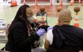 A health worker administers a COVID-19 vaccine shot to a local resident in Los Angeles, the United States. Photo by Xinhua.