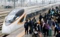 Passengers wait to board a train at Luoyang Longmen Railway Station in Luoyang, central China's Henan Province. Photo by Zhang Yixi/Xinhua.