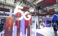 People visit the exhibition booth of China Mobile at the World 5G Convention in Harbin, capital of northeast China's Heilongjiang Province. Photo by Xinhua/Zhang Tao.