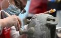 A contestant takes part in a match of metal cultural relics restorer during the national cultural relics industry vocational skills competition in Taiyuan, north China's Shanxi Province. Photo by Xinhua/Li He.