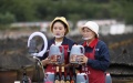 Two women promote vinegar products via livestreaming at a vinegar factory in Chishui, southwest China's Guizhou Province. Photo by Wang Changyu/Xinhua.