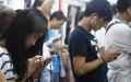 Most people aware of cellphone addiction and willing to prevent. Photo by Xinhua.