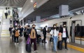 Passengers walk to board the train G99 at Shanghai Hongqiao Railway Station in east China's Shanghai. Photo by Xinhua/Wang Xiang.