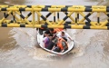 Rescuers transfer flood-trapped people in Zhuozhou, north China's Hebei Province. Photo by Xinhua/Mu Yu.
