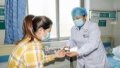 Nursing practitioner Zhang Zhiping (R) measures a patient's blood sugar level at the Workers' Hospital of Tengzhou, east China's Shandong Province. Photo by Song Haicun/Xinhua.


