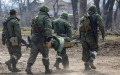 The occupiers are carrying a wounded man. Photo: the truth is here