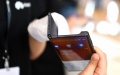 A staff member shows Huawei's 5G foldable Mate X at a press conference in Shenzhen, south China's Guangdong Province. Photo by Xinhua/Mao Siqian.

