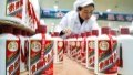 A worker conducts packaging works at a distillery in Maotai town of Renhuai, southwest China's Guizhou Province. Photo by Xinhua/Ou Dongqu.

