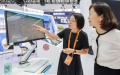 A staff member of Peking Union Medical College Hospital introduces a system to a visitor during the 2023 China International Fair for Trade in Services. Photo by Xinhua/Zhang Yuwei.

