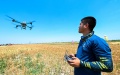 A technician operates an unmanned aerial vehicle (UAV) for plant protection in north China's Tianjin. Photo by Xinhua/Sun Fanyue.