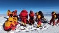 Members of a Chinese expedition team set up an automatic weather station on Mount Cho Oyu. Photo by Xinhua.