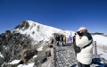 People visit snow-covered Changbai Mountain in northeast China's Jilin Province. Photo by Xinhua/Yan Linyun.