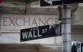 A Wall Street sign is seen in front of the New York Stock Exchange in New York, the United States. Photo by Michael Nagle/Xinhua.