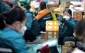 Staff members distribute parcels at a distribution center of China Post Group Co., Ltd. in Shijiazhuang, north China's Hebei Province. Photo by Liang Zidong/Xinhua.