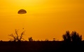 The return capsule of the Shenzhou-16 manned spaceship is about to touch down at the Dongfeng landing site in north China's Inner Mongolia Autonomous Region. Photo by Xinhua/Liu Jinhai.