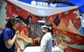 A visitor tries a tour guidance based on AR/VR effects at the booth of China Mobile during the 2023 China International Fair for Trade in Services (CIFTIS) at Shougang Park in Beijing. Photo by Xinhua/Li Xin.