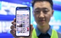 An engineer displays the mobile interface of a smart monitoring system for safety construction in Nanjing, east China's Jiangsu Province. Photo by Xinhua/Li Bo.