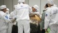 Scientific researchers prepare to take out the container loaded with moon samples from the returner of Chang'e-5 probe in Beijing, capital of China. Photo by Xinhua/Jin Liwang.