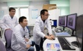 Researchers discuss experiment progress at the Institute of Geology and Geophysics of the Chinese Academy of Sciences in Beijing, capital of China. Photo by Xinhua/Jin Liwang.