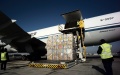 Staff members load cargo onto an aircraft at the Taoxian international airport in Shenyang, northeast China's Liaoning Province. Photo by Xinhua/Li Gang.