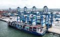 A container ship docking at an automation wharf of Qinzhou Port for unloading in Qinzhou, south China's Guangxi Zhuang Autonomous Region. Photo by Xinhua/Zhang Ailin.
