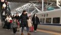 Travelers take a train at the Nanjing Railway Station in Nanjing, east China's Jiangsu Province. Photo by Yang Suping/Xinhua.