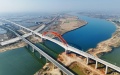 A high-speed train passing a grand bridge at Poyang Lake on Hangzhou-Nanchang high-speed railway in east China. Photo by Xinhua/Xing Guangli.