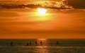 People enjoy themselves on the sea at sunset in Kota Kinabalu, Sabah, Malaysia. Photo by Xinhua/Cheng Yiheng.