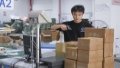 An employee works at a cross-border e-commerce company in Chongqing Fuling Comprehensive Bonded Zone, southwest China's Chongqing Municipality. Photo by Xinhua/Wang Quanchao.