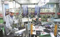 An employee works on a circuit board production line of an electronics company in Zhangzhou, Fujian province. Photo/Xinhua.