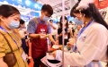 Visitors taste Luosifen rice noodles during the China-ASEAN Expo at Nanning International Convention and Exhibition Center in Nanning, capital of south China's Guangxi Zhuang Autonomous Region. Photo by Xinhua/Huang Xiaobang.
