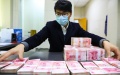 China's banking sector assets up. Photo by Xinhua.