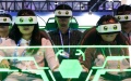 People try VR devices during the 11th China (Wuhu) Popularized Science Products Exposition in Wuhu, east China's Anhui Province. Photo by Xinhua/Du Yu.