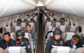 Criminal suspects escorted by Chinese police officers are pictured on a charter flight to China.  Photo by Xinhua/Yin Gang.