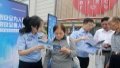 Police officers in Yangzhou City, east China's Jiangsu Province, talk to people about internet safety and preventing telecommunications fraud. Photo by Xinhua.