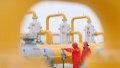 Workers patrol at a station of the Tarim Oilfield in northwest China's Xinjiang Uygur Autonomous Region. Photo by Xinhua/Li Xiang.