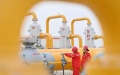 Workers patrol at a station of the Tarim Oilfield in northwest China's Xinjiang Uygur Autonomous Region. Photo by Xinhua/Li Xiang.