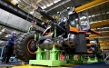 An employee works at a wheel loader assembly line of a Develon subsidiary in Yantai, east China's Shandong Province. Photo by Xinhua/Guo Xulei.