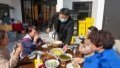 Liu Yuelong (3rd L), an agritainment owner, serves the table in Shushan Village in Tong'an Town of Suzhou City, east China's Jiangsu Province.Photo by Xinhua/Li Bo.