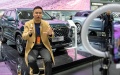 A man performs livestreaming during an automobile exposition at the Changsha International Convention and Exhibition Center in Changsha, central China's Hunan Province. Photo by Xinhua/Chen Sihan.